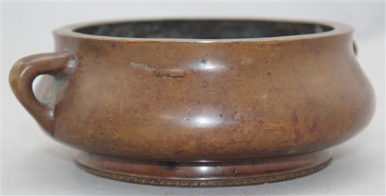 A Chinese bronze two handled censer, Gui, Xuande two character mark, 19cm.